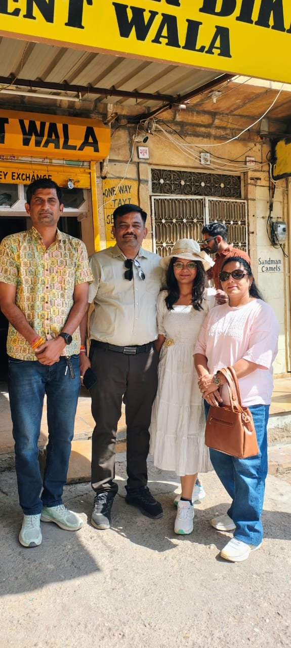 Saim with guests in the market