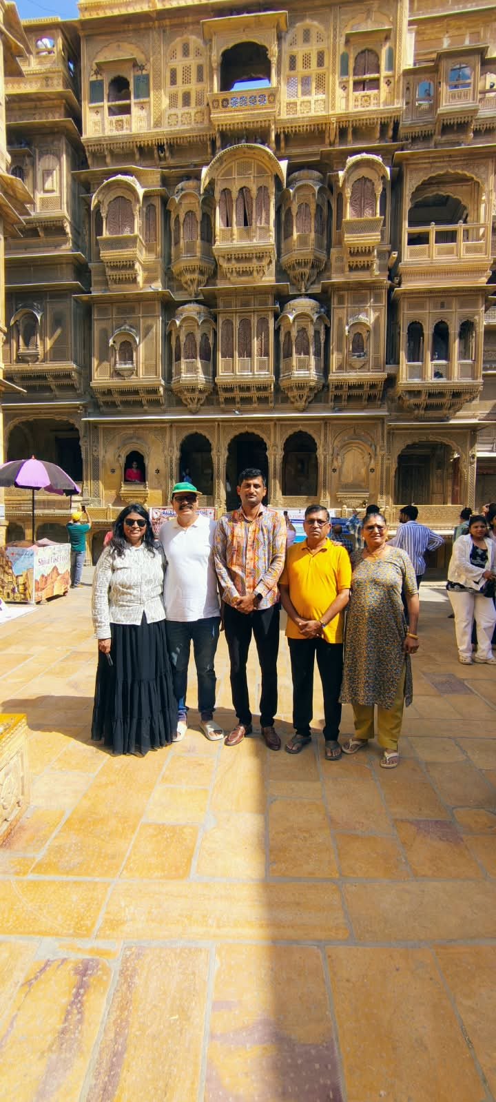 Saim with a family at Patwa Haveli
