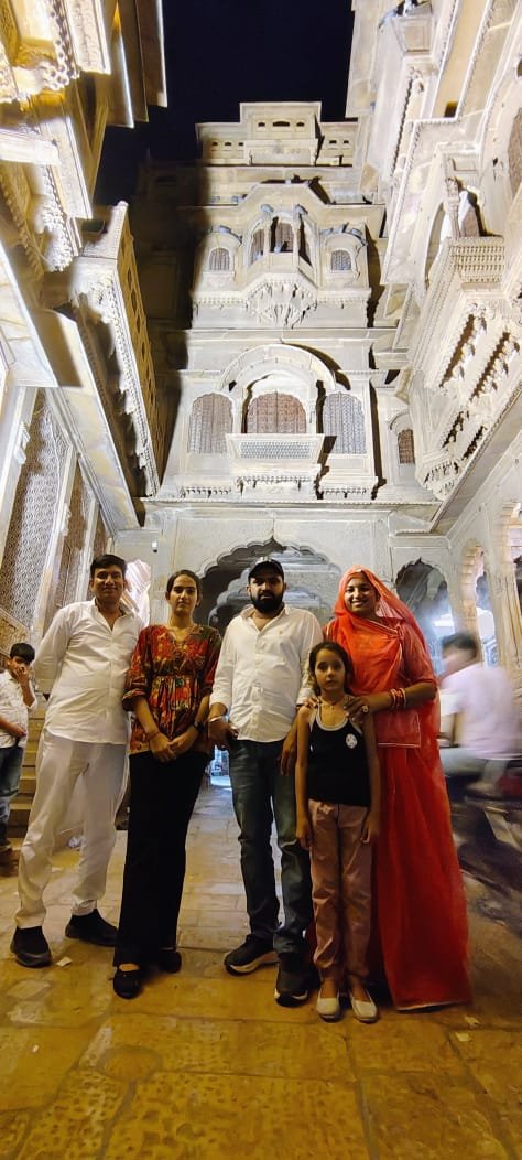 Family at a haveli by night